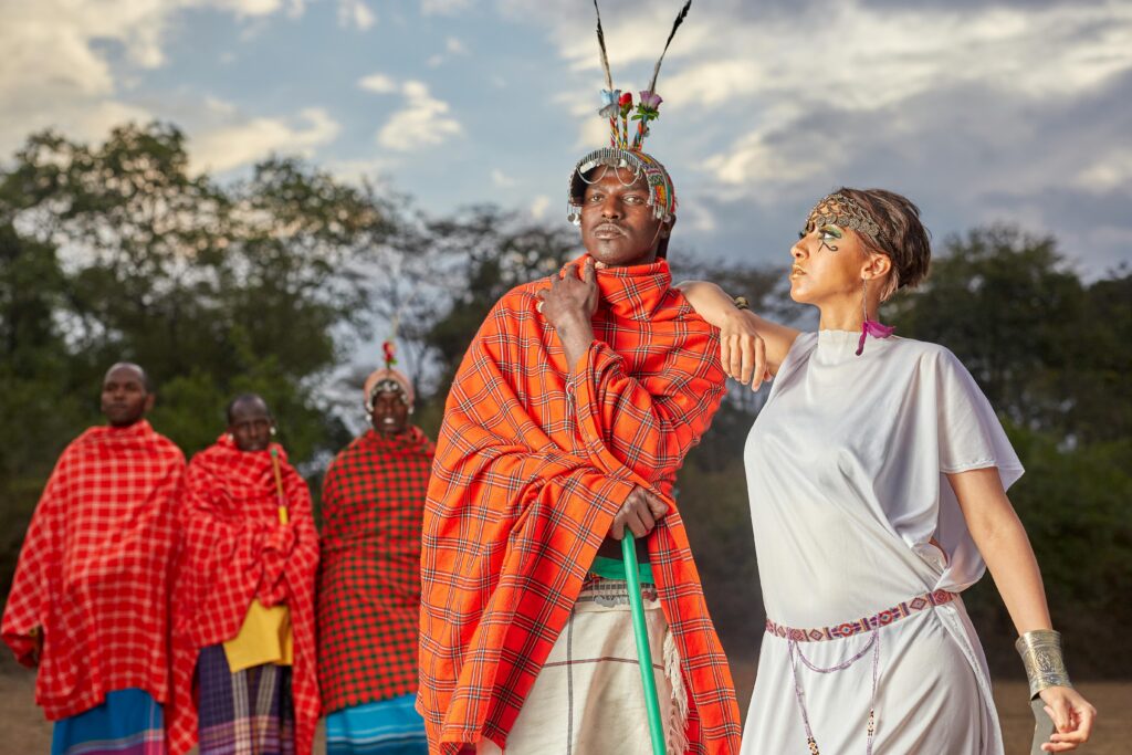 A vibrant group portrait showcasing traditional Maasai attire in Kenya's serene landscape.